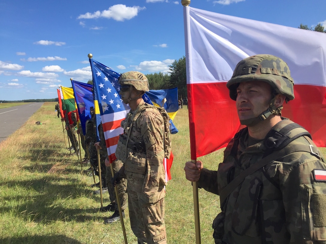 Soldiers representing eight nations display their national colors during an opening ceremony for Exercise Anakonda 2016 at the Drawsko Pomorskie Training Area, Poland, June 6. Exercise Anakonda 2016 is a Polish-led, joint multinational exercise taking place throughout Poland June 7-17. The exercise involves approximately 31,000 participants from more than 20 nations. Exercise Anakonda 2016 is a premier training event for U.S. Army Europe and participating nations and demonstrates the United States and partner nations can effectively unite under a unified command while training on a contemporary scenario. (U.S. Army photo by Timothy L. Hale) (Released)