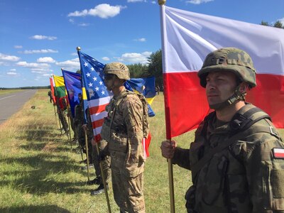 Soldiers representing eight nations display their national colors during an opening ceremony for Exercise Anakonda 2016 at the Drawsko Pomorskie Training Area, Poland, June 6. Exercise Anakonda 2016 is a Polish-led, joint multinational exercise taking place throughout Poland June 7-17. The exercise involves approximately 31,000 participants from more than 20 nations. Exercise Anakonda 2016 is a premier training event for U.S. Army Europe and participating nations and demonstrates the United States and partner nations can effectively unite under a unified command while training on a contemporary scenario. (U.S. Army photo by Timothy L. Hale) (Released)