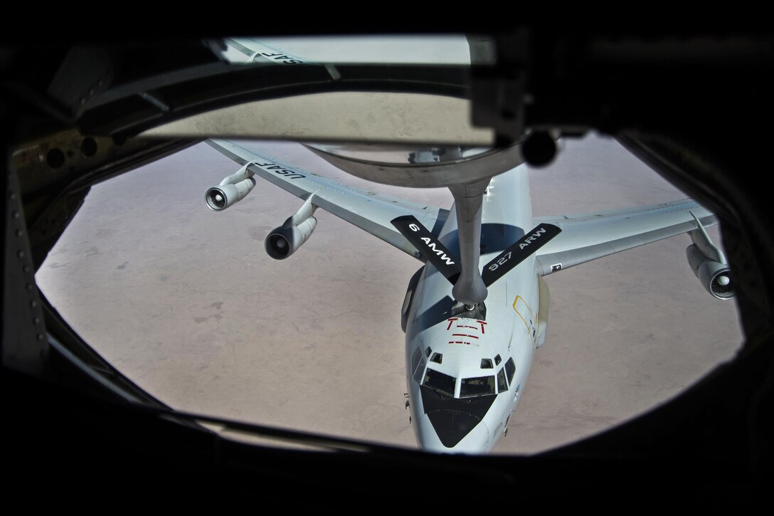 An Air Force KC-135 Stratotanker aircraft refuels an E-3 Sentry over Iraq in support of Operation Inherent Resolve, May 31, 2016. Air Force photo by Staff Sgt. Larry E. Reid Jr.