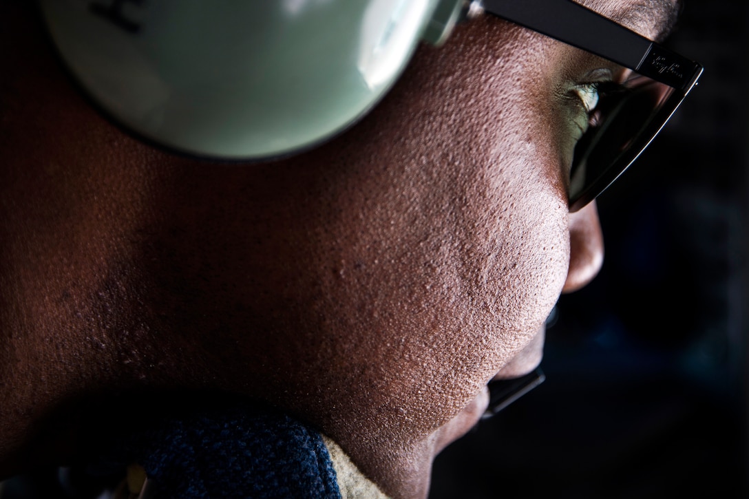 Senior Airman Darhon Hambrick communicates with the E-3 Sentry  aircraft crew during a refueling mission over Iraq in support of Operation Inherent Resolve, May 31, 2016. Air Force photo by Staff Sgt. Larry E. Reid Jr.