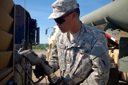 Pfc. Aung Kyaw, a petroleum supply specialist with the U.S. Army Reserve's 716th Quartermaster Company, Jersey City, N.J., fuels a Humvee at the fuel farm during Exercise Anakonda 16 at the Drawsko Pomorskie Training Area, Poland, June 4, 2016. Anakonda 16 is a Polish-led, joint multinational exercise taking place throughout Poland June 7-17. The 716th is the first U.S. Army Reserve unit to operate a fuel farm in Poland. The exercise involves more than 25,000 participants from more than 20 nations. Anakonda 16 is a premier training event for U.S. Army Europe and participating nations and demonstrates the United States and partner nations can effectively unite under a unified command while training on contemporary scenario. (U.S. Army photo by Timothy L. Hale) (Released)