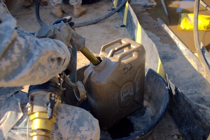 Spc. Dan Bora, a petroleum supply specialist with the U.S. Army Reserve's 716th Quartermaster Company, Jersey City, N.J., fuels a 5-gallon gas can at the fuel farm during Exercise Anakonda 2016 at the Drawsko Pomorskie Training Area, Poland, June 4. Exercise Anakonda 2016 is a Polish-led, joint multinational exercise taking place throughout Poland June 7-17. The 716th is the first U.S. Army Reserve unit to operate a fuel farm in Poland. The exercise involves more than 25,000 participants from more than 20 nations. Exercise Anakonda 2016 is a premier training event for U.S. Army Europe and participating nations and demonstrates the United States and partner nations can effectively unite under a unified command while training on contemporary scenario. (U.S. Army photo by Timothy L. Hale) (Released)