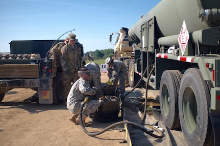 Spc. Dan Bora, a petroleum supply specialist with the U.S. Army Reserve's 716th Quartermaster Company, Jersey City, N.J., fuels a 5-gallon gas can at the fuel farm during Exercise Anakonda 16 at the Drawsko Pomorskie Training Area, Poland, June 4, 2016. Anakonda 16 is a Polish-led, joint multinational exercise taking place throughout Poland June 7-17. The 716th is the first U.S. Army Reserve unit to operate a fuel farm in Poland. The exercise involves more than 25,000 participants from more than 20 nations. Anakonda 16 is a premier training event for U.S. Army Europe and participating nations and demonstrates the United States and partner nations can effectively unite under a unified command while training on contemporary scenario. (U.S. Army photo by Timothy L. Hale) (Released)