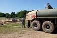 Petroleum supply specialists with the U.S. Army Reserve's 716th Quartermaster Company, Jersey City, N.J., fill a 5,000-gallon tanker truck at the bulk fuel farm during Exercise Anakonda 2016 at the Drawsko Pomorskie Training Area, Poland, June 4, 2016. Exercise Anakonda 2016 is a Polish-led, joint multinational exercise taking place throughout Poland June 7-17. The 716th is the first U.S. Army Reserve unit to operate a fuel farm in Poland. The exercise involves more than 25,000 participants from more than 20 nations. Exercise Anakonda 2016 is a premier training event for U.S. Army Europe and participating nations and demonstrates the United States and partner nations can effectively unite under a unified command while training on contemporary scenario. (U.S. Army photo by Timothy L. Hale) (Released)