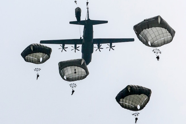 U.S., French and German paratroopers jump into Sainte Mere Eglise, France