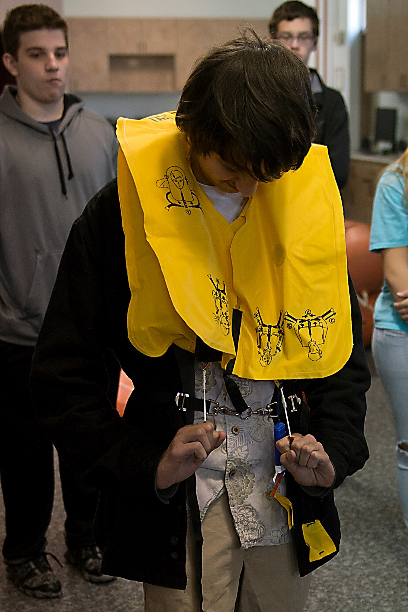 Harrison McClish, a student at Northwestern Middle School, inflates a life vest during a visit to the 434th Operations Support Squadron May 18, 2016 at Grissom Air Reserve Base, Ind. The students visited Aircrew Flight equipment before going to the flightline to see one of Grissom’s KC-135R Stratotankers. (U.S. Air Force photo/Senior Airman Dakota Bergl)