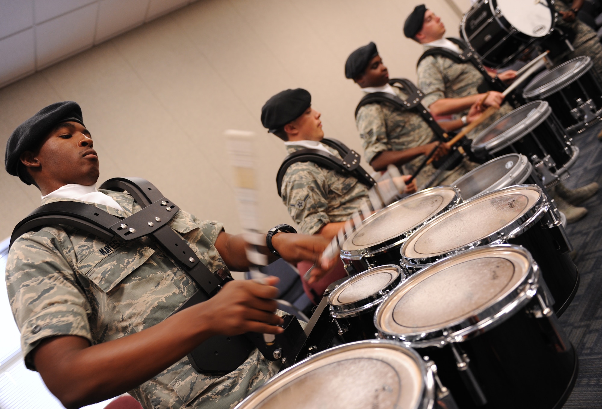 Airman Basic Deandre Mayes, 81st Training Wing Drum and Bugle Corps tenor drum player, plays a musical piece during a practice session at the Levitow Training Support Facility May 31, 2016, Keesler Air Force Base, Miss. The drum and bugle corps performs at various events such as 81st Training Group student parades and drill downs in addition to attending Air Force specialty code technical training on a daily basis. (U.S. Air Force photo by Kemberly Groue)