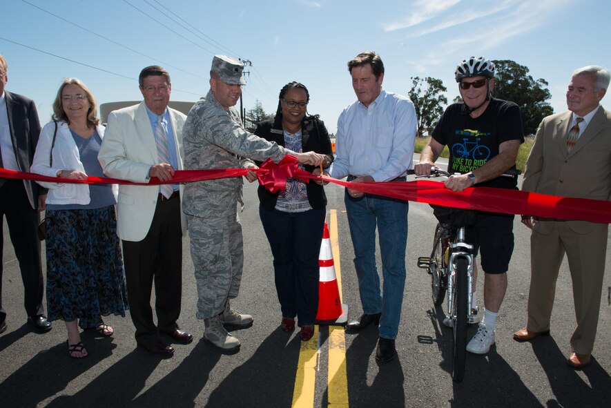 Leaders from Solano County and Travis Air Force Base cut a ribbon during a ceremony in Suisun City, Calif., June 3, 2016. The ribbon cutting signifies the completion of the Travis Air Force Base South Gate Improvement Project, a $3.1 million construction project to improve safety and reliability to the south gate entrance by creating a truck-queueing lane adjacent to the two travel lanes and connects the south gate to the Jepson Parkway. (U.S. Air Force photo by Louis Briscese/Released)