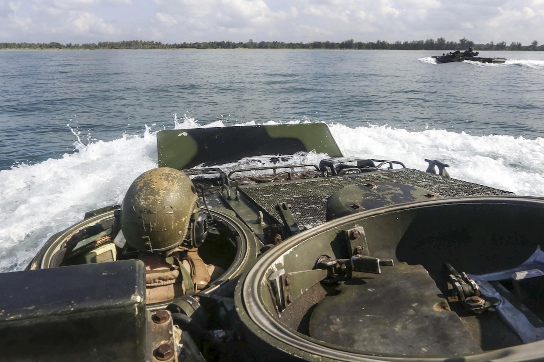 Marines engage in an amphibious transition from ship to shore as they support exercise Cooperation Afloat Readiness and Training at the Darvel Bay, Malaysia, May 30, 2016. The annual exercise includes nine partner nations. The Marines are assigned to Easy Company, 2nd Battalion, 2nd Marine Regiment. Marine Corps photo by Lance Cpl. Carl King Jr.