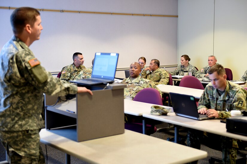 Officers assigned to the 5th Armored Brigade, Fort Bliss, Texas discuss mobilization issues at the Fiscal Year 17 mobilization conference hosted by the 85th Support Command headquarters in Arlington Heights, Ill., June 4, 2016.
(U.S. Army photo by Spc. David Lietz/Released)