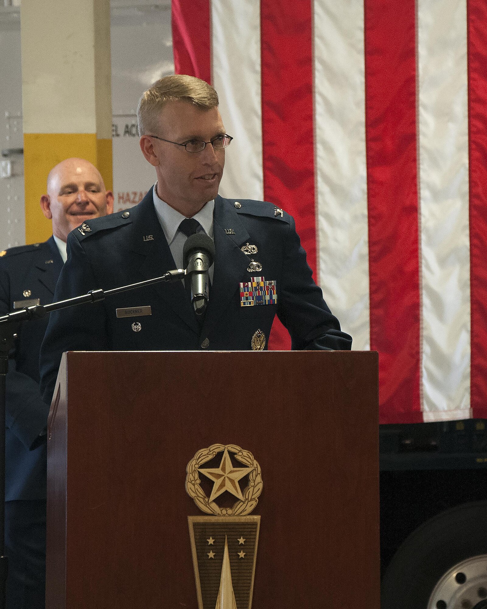 Col. Greg Buckner, 90th Maintenance Group commander, speaks to Airmen from the 90th Missile Wing and the 20th Air Force after assuming command of the 90th Maintenance Group June 3, 3016, inside the Maintenance High Bay on F.E. Warren Air Force Base, Wyo. Buckner came to the wing after working at the 20th Air Force as the director of logistics and planning. (U.S. Air Force photo by Senior Airman Brandon Valle)