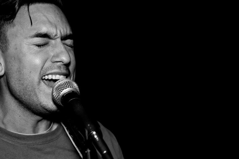 Tech. Sgt. James, 78th Attack Squadron intelligence formalized training unit NCO in-charge, sings during a band rehearsal June 2, 2016 in Las Vegas. James is part of a five man group consisting of two guitarists, a drummer, a saxophonist and a vocalist. The band often plays music at military ceremonies and events hosted for other Airmen assigned to the 432nd Wing/432nd Air Expeditionary Wing. (U.S. Air Force photo by Senior Airman Adarius Petty)