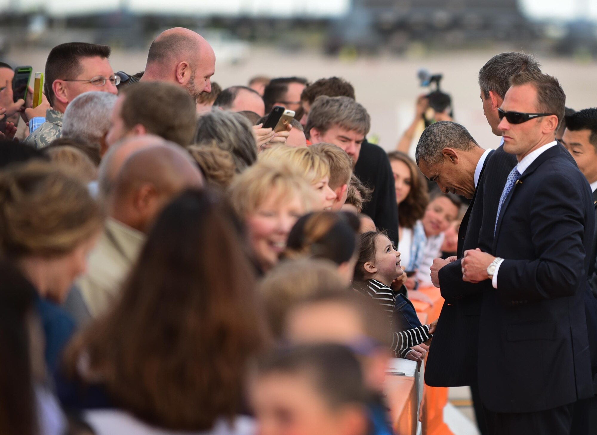 President Barack Obama shakes hands with one of his smallest enthusiasts at Peterson Air Force Base, Colo., June 1, 2016. Obama spoke before more than 28,000 people as he delivered the commencement address at the 2016 Air Force Academy graduation. (U.S. Air Force photo by Staff Sgt. Amber Grimm)