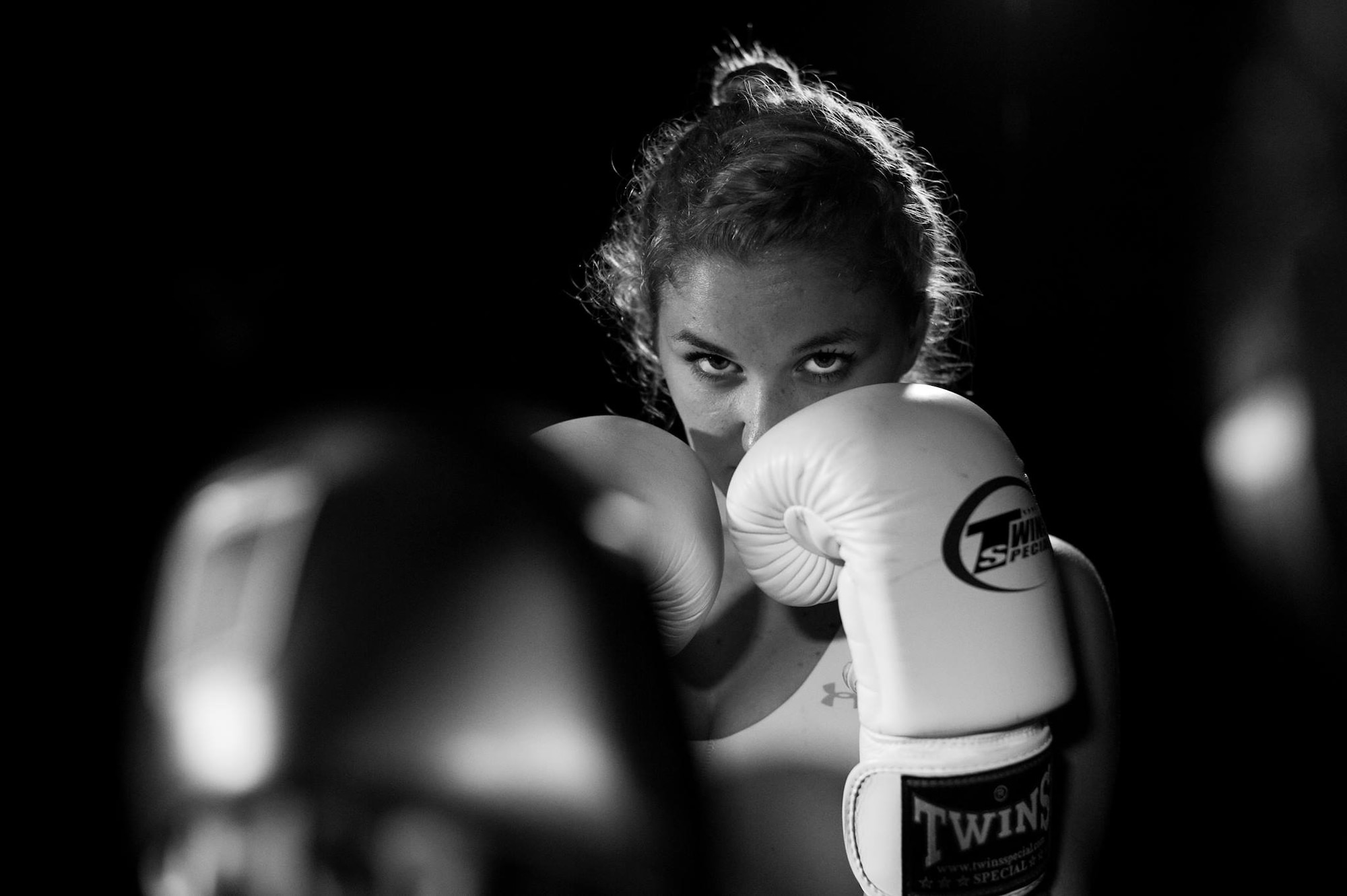 2nd Lt Kaitlin Daddona drills with her boxing training partner on Joint Base Pearl Harbor-Hickam, November 25, 2015. (U.S Air Force photo by Senior Airman Michael Reeves)