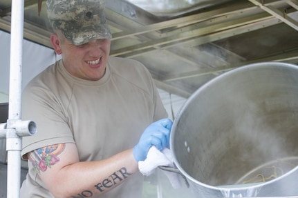 Spc. Zachary McDavid, a culinary specialist assigned to the 200th Military Police Command, drains a pot of pasta on his unit's Mobile Kitchen Trailer (MKT) in preparation for lunch during the unit’s battle assembly at Fort Meade, Maryland, on June 4, 2016. The command’s goal is to have each of its units become proficient with their MKT so when they have to mobilize they are ready and prepared to use it. (U.S. Army photo by Spc. Stephanie Ramirez) 