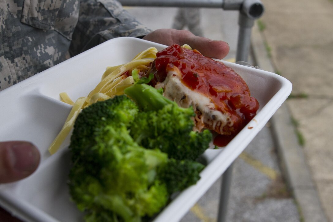 Culinary specialists assigned to the 200th Military Police Command take out their Mobile Kitchen Trailer (MKT) and prepare lunch during the unit’s battle assembly at Fort Meade, Maryland, on June 4, 2016. The command’s goal is to have each of its units become proficient with their MKT so when they have to mobilize they are ready and prepared to use it. (U.S. Army photo by Spc. Stephanie Ramirez) 