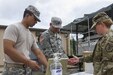 Culinary specialists assigned to the 200th Military Police Command keep accountability as they serve lunch out of their unit's Mobile Kitchen Trailer (MKT) during battle assembly at Fort Meade, Maryland, on June 4, 2016. The command’s goal is to have each of its units become proficient with their MKT so when they have to mobilize they are ready and prepared to use it. (U.S. Army photo by Spc. Stephanie Ramirez)