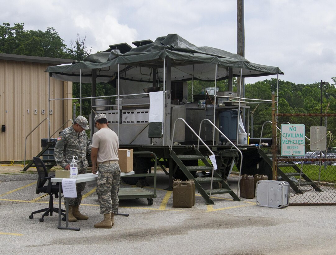 Culinary specialists assigned to the 200th Military Police Command keep accountability as they serve lunch out of their unit's Mobile Kitchen Trailer (MKT) during battle assembly at Fort Meade, Maryland, on June 4, 2016. The command’s goal is to have each of its units become proficient with their MKT so when they have to mobilize they are ready and prepared to use it. (U.S. Army photo by Spc. Stephanie Ramirez)