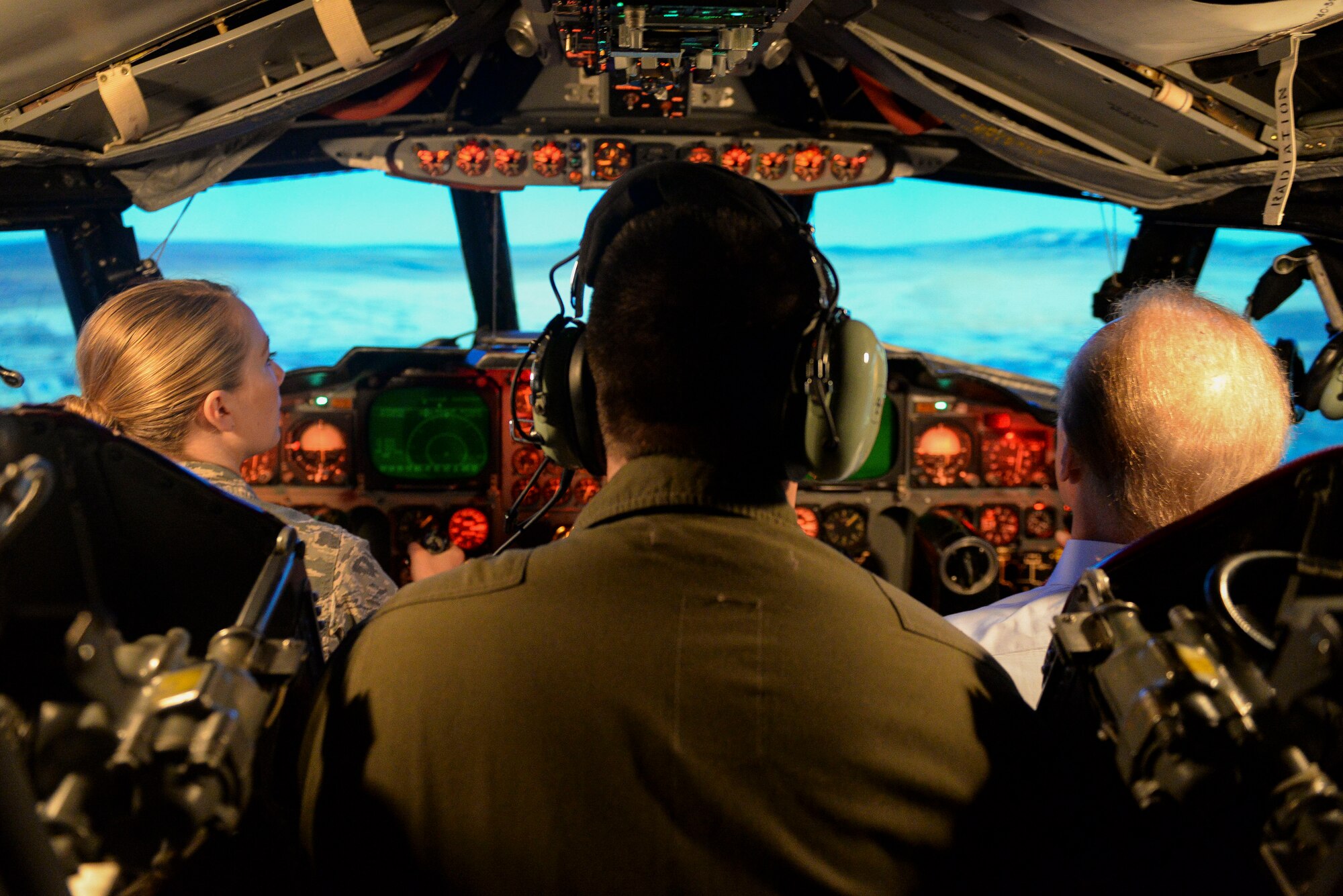 Robert “Rocky” Bleier, a Vietnam veteran and former Pittsburg Steelers football player, and Staff Sgt. Heather Veldhouse, an Airman assigned to the 5th Bomb Wing Information Protection office, operates the B-52 Stratofortress flight simulator under the watchful eye of Capt. Joshua Freeman, a pilot assigned to the 23rd Bomb Squadron, at Minot Air Force Base, N.D., May 26, 2016. Bleier and Veldhouse attempted in-flight refueling and aerial stunts during the simulation. (U.S. Air Force photo/Airman 1st Class Jessica Weissman)