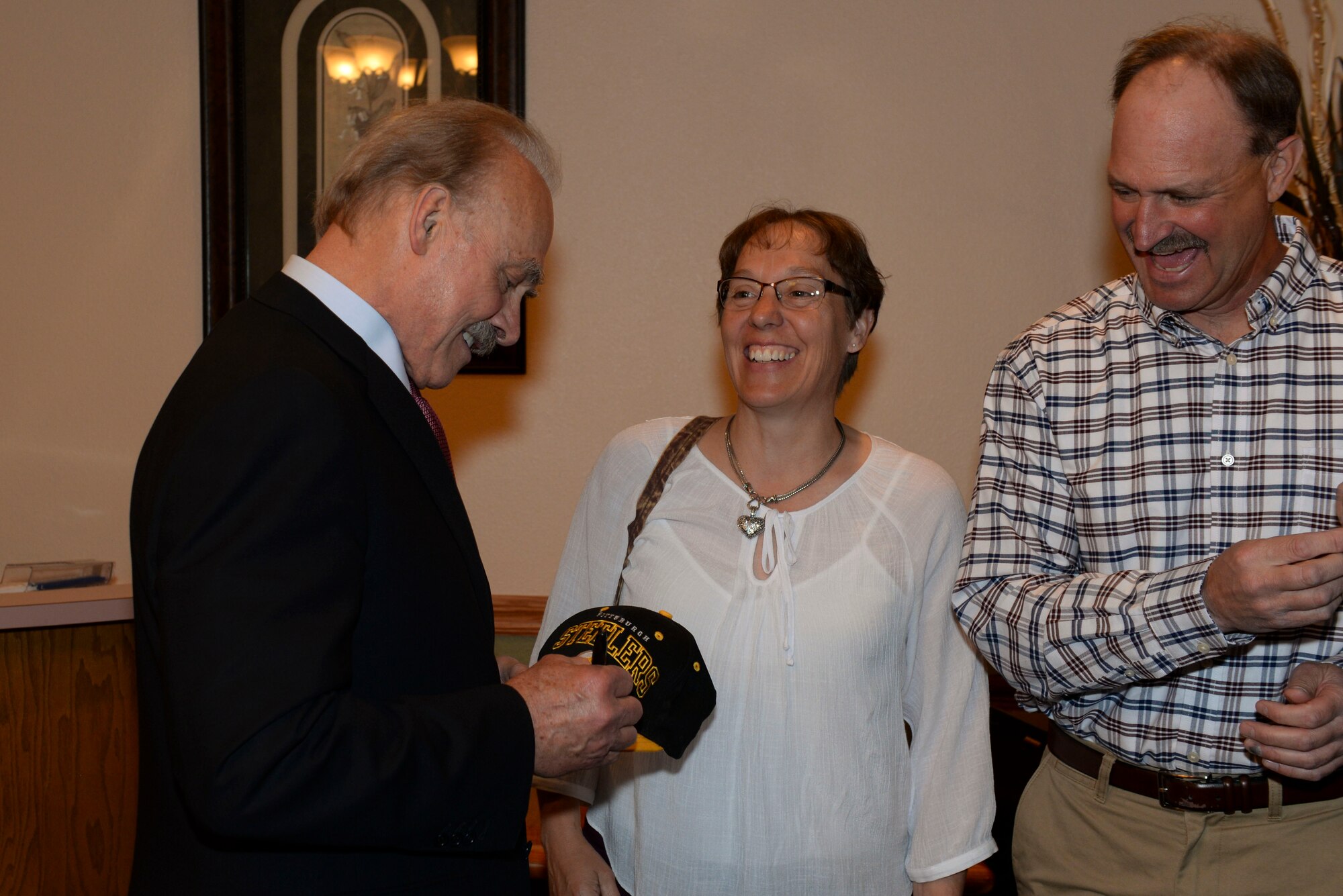 Robert “Rocky” Bleier, a Vietnam veteran and former Pittsburg Steelers football player, signed autographs at the Jimmy Doolittle Center at Minot Air Force Base, N.D., May 26, 2016. Bleier visited many Minot AFB facilities and shared stories from the football fields of America to the battle fields of Vietnam. (U.S. Air Force photo/Airman 1st Class Jessica Weissman)
