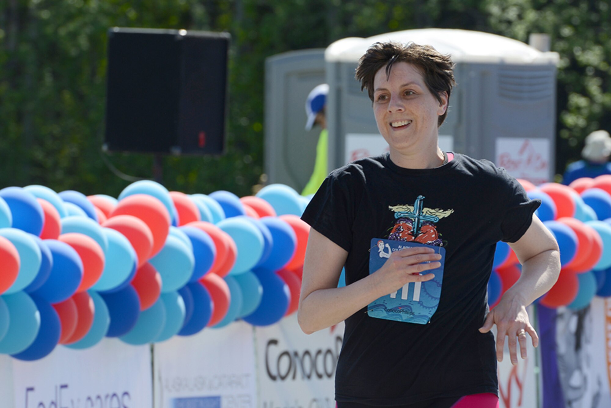 Senior Master Sgt. Tracie Timmerman, 673d Force Support Squadron Manpower and Personnel Flight superintendent, finishes the Gold Nugget Triathlon at Bartlett High School, Alaska, May 15, 2016. The all-women’s triathlon consisted of a 500-yard lap swim, 12-mile biking trail and 4.1-mile run. Timmerman finished the triathlon in 3 hours, 4 minutes, 31 seconds. (U.S. Air Force photo by Airman 1st Class Christopher R. Morales)