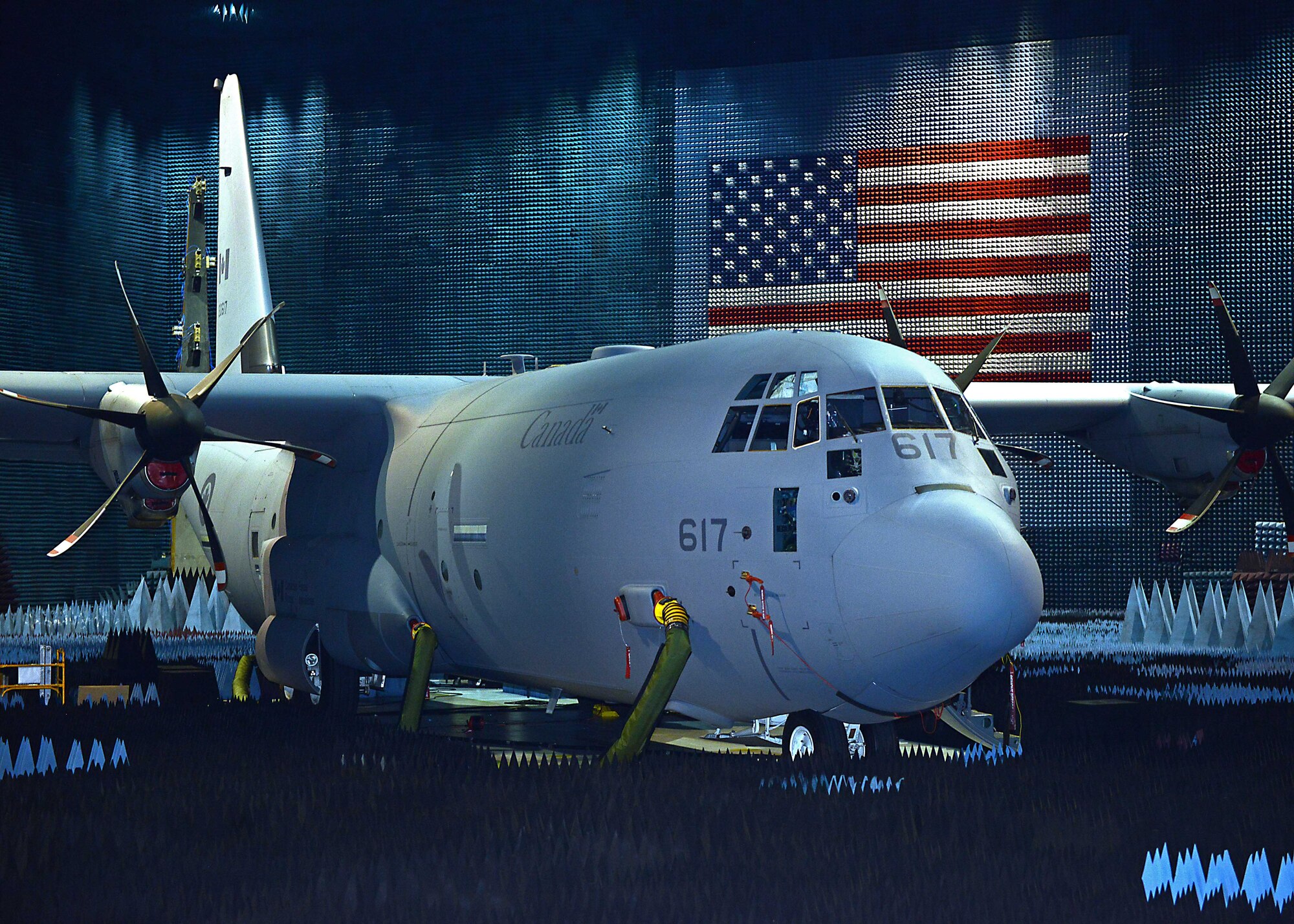 A Royal Canadian Air Force CC-130J transport plane sits in the Benefield Anechoic Facility May 24 undergoing electronic warfare testing. The CC-130J is from 8 Wing located at Canadian Forces Base Trenton, Ontario. The J model has six propellers and can fly faster, higher and farther than legacy versions, while carrying heavier loads with better fuel economy. (U.S. Air Force photo by Kenji Thuloweit)