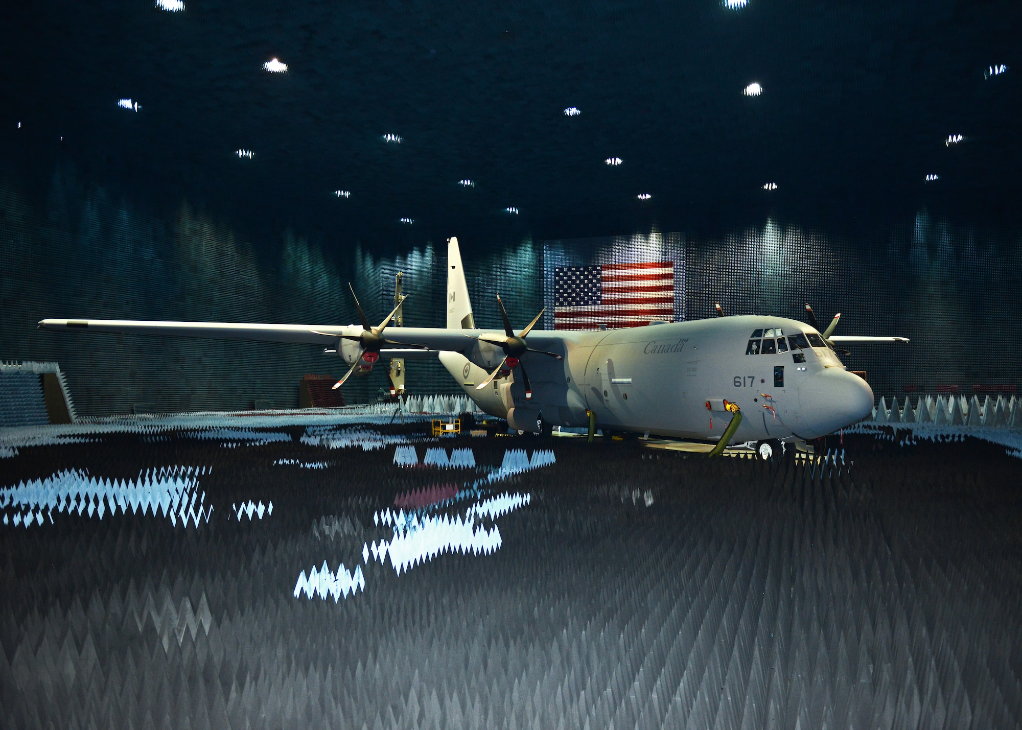 A Royal Canadian Air Force CC-130J transport plane sits in the Benefield Anechoic Facility undergoing electronic warfare testing. Canada purchased 17 CC-130Js with the last one delivered in 2012. This test program puts the CC-130J closer to full operational capability. (U.S. Air Force photo by Kenji Thuloweit)