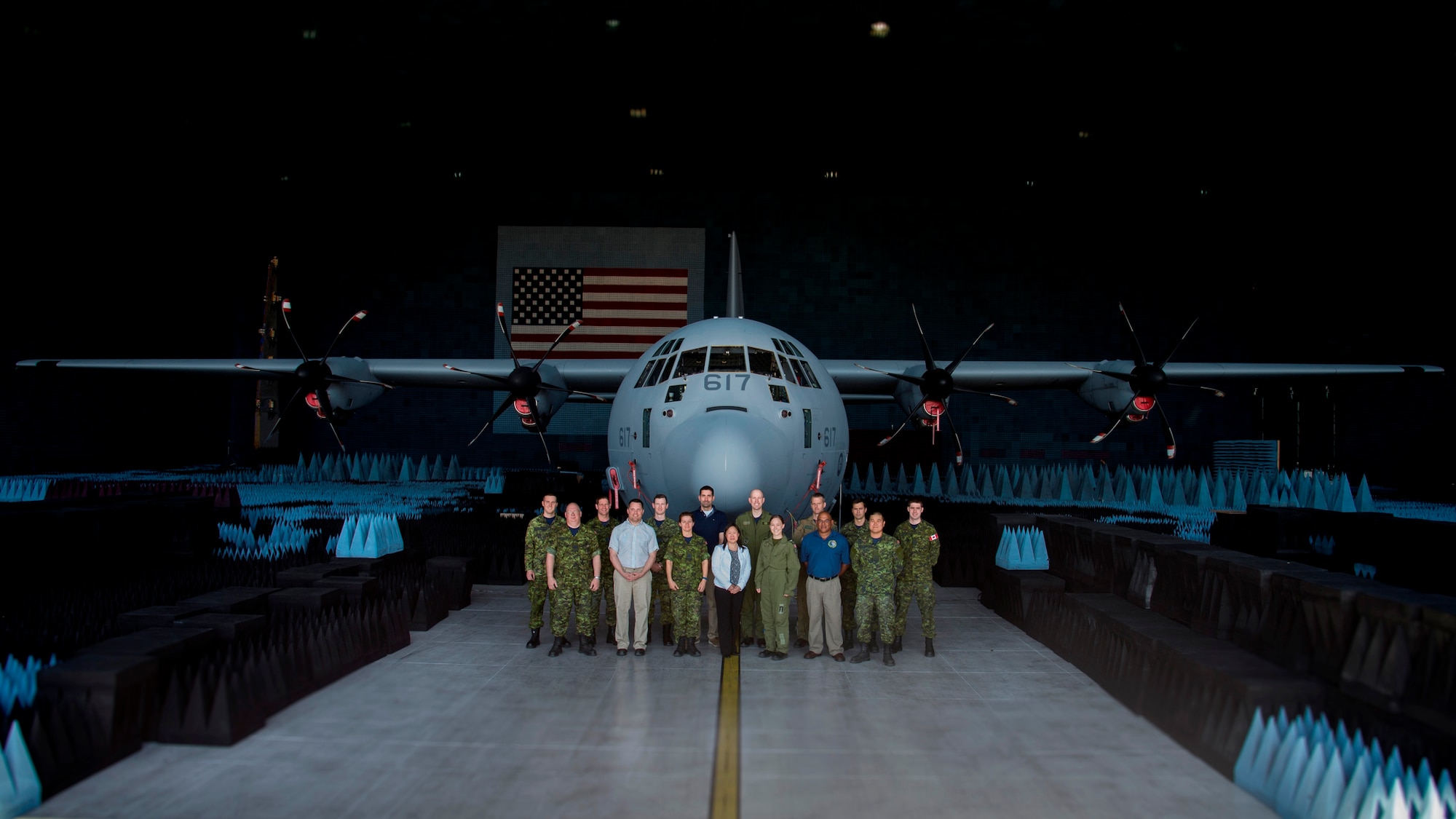 Members of the CC-130J test team pose in front of their aircraft in the Benefield Anechoic Facility in late May. Left to Right – Back Row: Cpl. Tim Copper, Capt. Leslie Karasz, Capt. Liam Field, Emil Poliakov, Maj. Adam Emond, Capt. Rob McIntosh, Cpl. Simon Bilodeau, Cpl. Kevin Rodych. Left to Right – Front Row:  Sgt. Mark Smythe, Fred Dilkes, Master Cpl. Tami Bolduc, Jenny Chuang, Cpl. Allyssa Carter, Kurt Patrick, Avr. Jae Park. (Royal Canadian Air Force photo)
