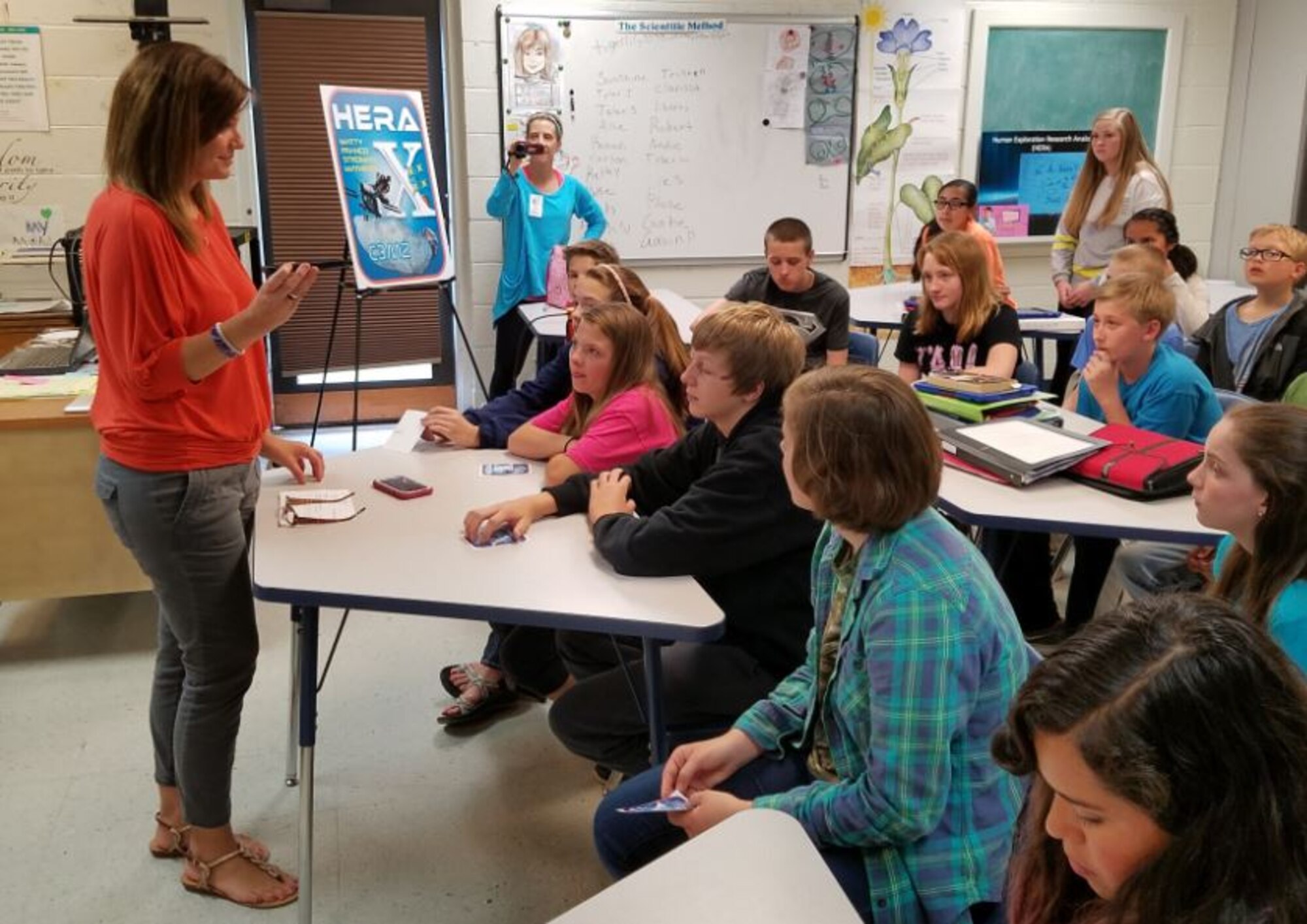 The Manchester Westwood Middle School science teacher Deb Wimberley (left) uses her phone for her students to communicate with the Human Exploration Research Analog (HERA) X crew members during a simulated space mission May 5 at Johnson Space Center in Houston. AEDC STEM Center coordinator Jere Matty facilitated the communication. (Courtesy photo)