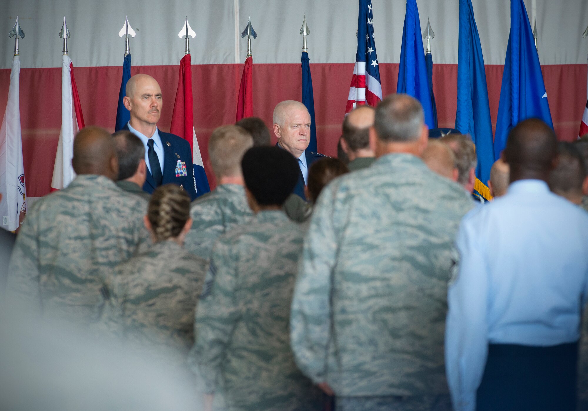 Chief Master Sergeant Ronald C. Anderson (left) and Lt. Gen. L. Scott Rice (center), director of the Air National Guard stand at attention during the playing of the national anthem at a welcome ceremony June 2, 2016, at Joint Base Andrews, Md. Anderson was introduced as the 12th command chief master sergeant for the Air National Guard. (U.S. Air National Guard photo by Master Sgt. Marvin R. Preston/Released)