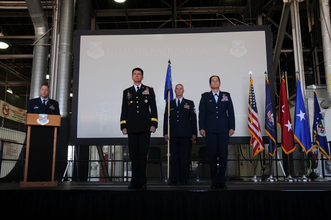 U.S. Army Maj. Gen. Jefferson Burton, Utah National Guard adjutant general, and Col. Kristin Streukens stand at attention during the 151st Air Refueling Wing assumption of command ceremony at Roland R. Wright Air National Guard Base, UT., June 4, 2016. Streukens will assume responsibility for more than 1,400 Airmen and current missions that include training and operational aerial refueling, airlift and aeromedical evacuation, intelligence, airspace control, cyber infrastructure and information operations (U.S. Air National Guard photo by Staff Sgt. Colton Elliott/Released)