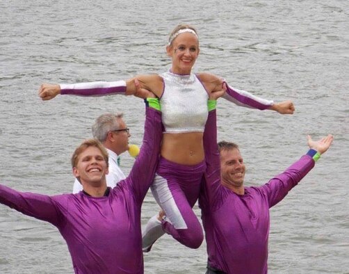 U.S. Air Force Capt. Amy Nordquist, center, is held up by Andy Nordquist, right, and Chris Sluis, left, while performing a maneuver called “Trios” at the National competition with the Twin Cities River Rats Show Team in Loves Park, IL. Every year, Nordquist organizes a military appreciation night, which proceeds go to the Minnesota Military Appreciation Fund.(Photo Courtesy of U.S. Air Force Capt. Amy Nordquist)