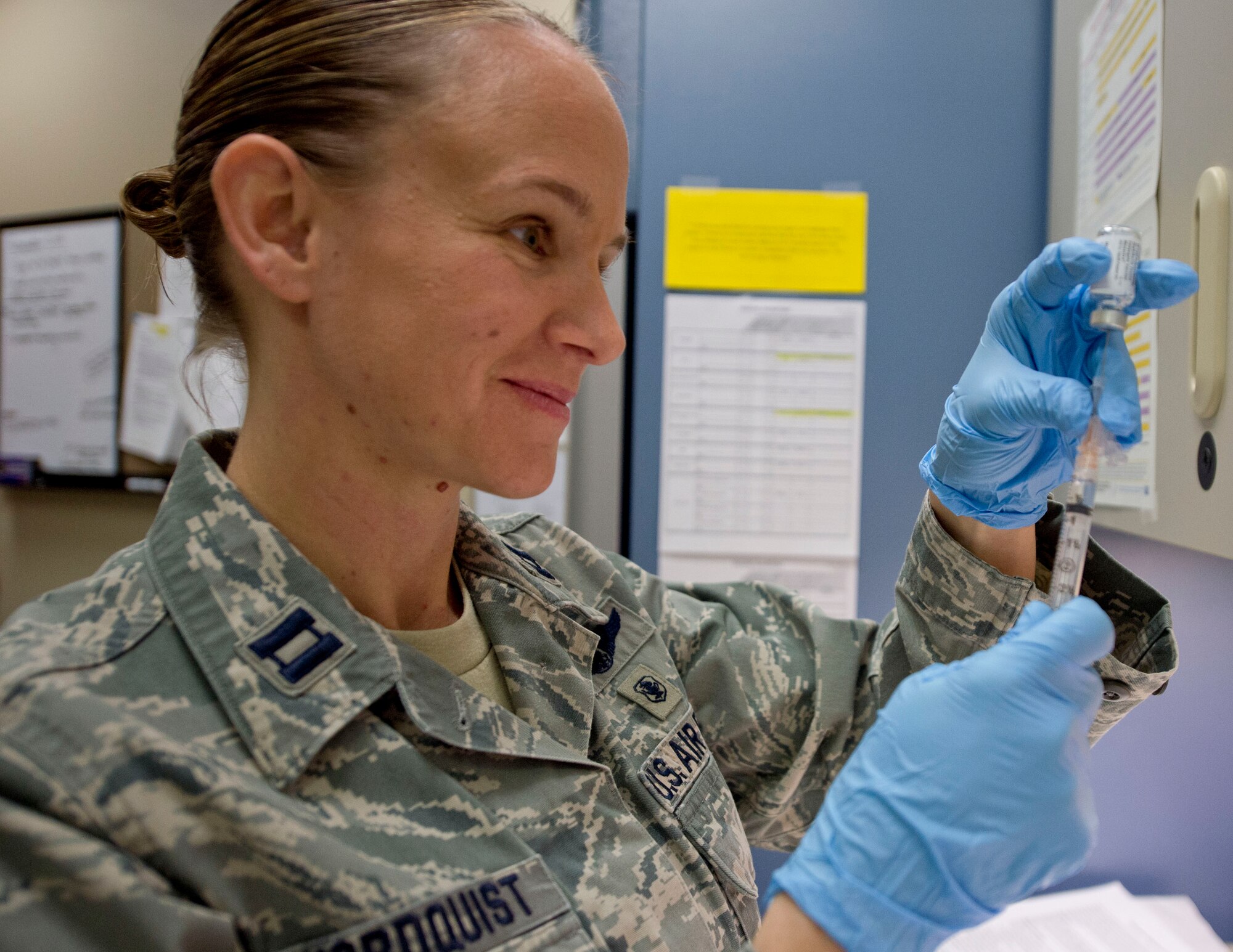 U.S. Air Force Capt. Amy Nordquist, 133rd Medical Group, fills a needle with a vaccine in St. Paul, Minn., Jan. 23, 2016. The vaccine is a mandatory requirement for the Airmen in order to stay healthy and prevent sickness. 
(U.S. Air National Guard photo by Tech. Sgt. Amy M. Lovgren/Released)