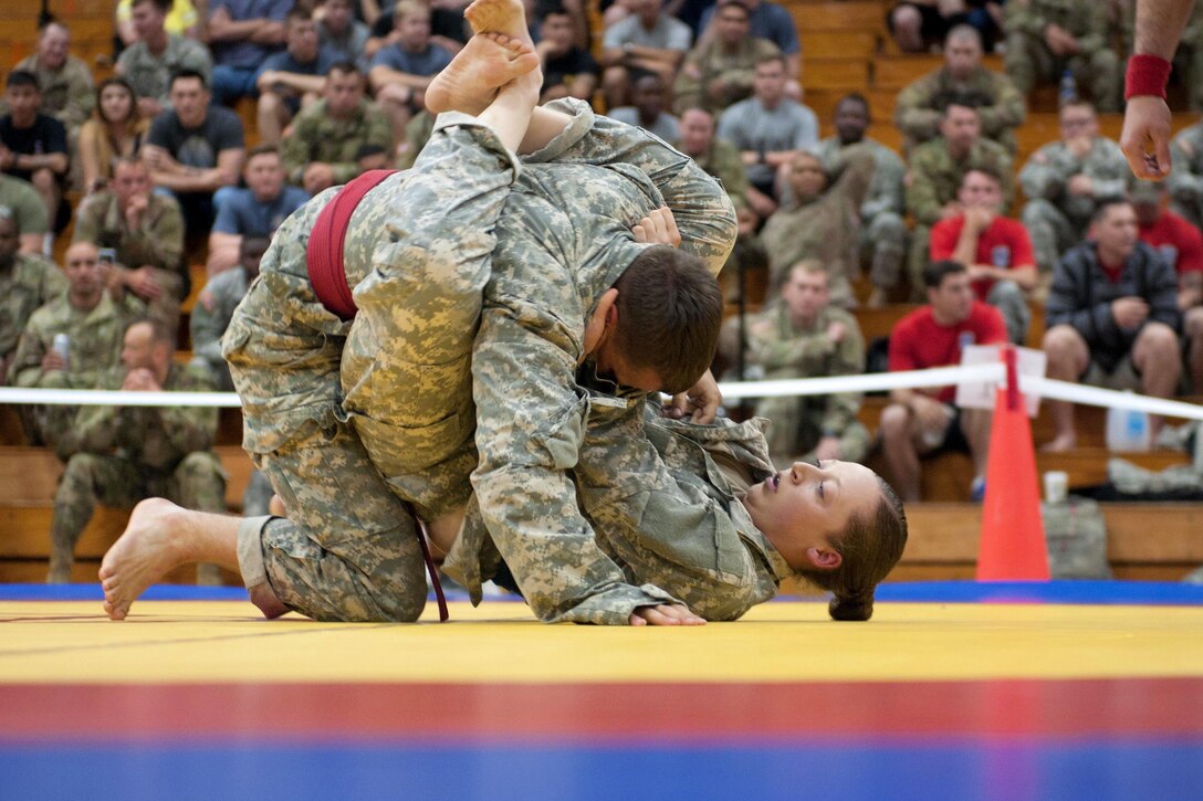 Army Spc. Megan Sue Shea, right, competes during the All American Week 2016 Combatives Tournament at Fort Bragg, N.C., May 24, 2016. Shea is a unit armorer assigned to the 82nd Airborne Division’s Sustainment Brigade. Army photo by Staff Sgt. Adam C. Keith