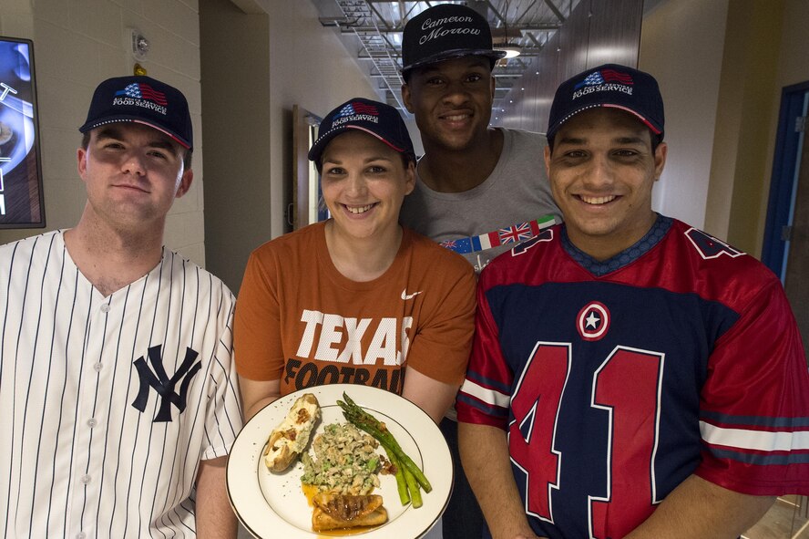 Team “Slam Dunk Flavors” pose for a photo during a Top Chef Competition, June 3, 2016, at Moody Air Force Base, Ga. Out of four categories, the team won best dessert for their apple chimichangas. (U.S. Air Force photo by Airman 1st Class Janiqua P. Robinson/Released)