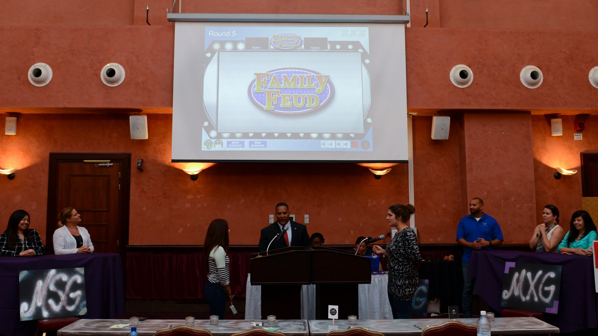 Aviano spouses face-off during the second quarter “Spouse It Up: Family Feud” competition, June 2, 2016, at Aviano Air Base, Italy. The quarterly event aims to raise morale and bring Aviano families closer together. (U.S. Air Force photo by Senior Airman Austin Harvill/Released)