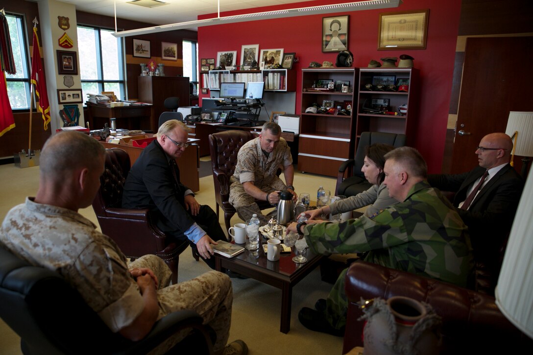 Peter Hultqvist, Sweden's Minister of Defense (left), sits with U.S. Marine Forces Command's Commanding General Lt. Gen. John E. Wissler as they enjoy refreshments and talk among each other at MARFORCOM in Norfolk, Virginia, June 6. (Official U.S. Marine Corps Photo by Cpl. Calvin Shamoon/ Released)
