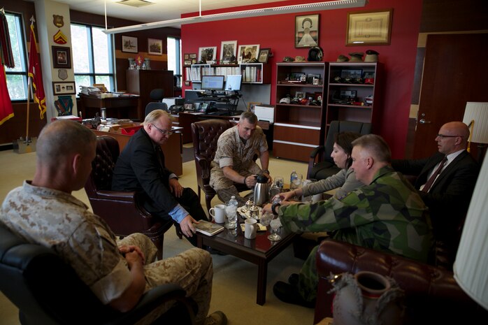Peter Hultqvist, Sweden's Minister of Defense (left), sits with U.S. Marine Forces Command's Commanding General Lt. Gen. John E. Wissler as they enjoy refreshments and talk among each other at MARFORCOM in Norfolk, Virginia, June 6. (Official U.S. Marine Corps Photo by Cpl. Calvin Shamoon/ Released)