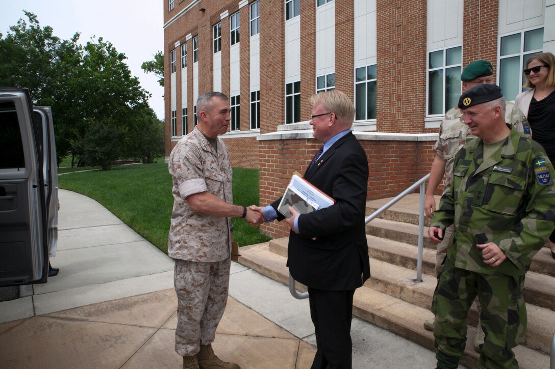 Lt. Gen. John E. Wissler, U.S. Marine Forces Command commanding general, bids farewell Sweden's Minister of Defense Peter Hultqvist, June 6, after his visit to MARFORCOM in Norfolk, Virginia. (Official U.S. Marine Corps Photo by Cpl. Calvin Shamoon/ Released)