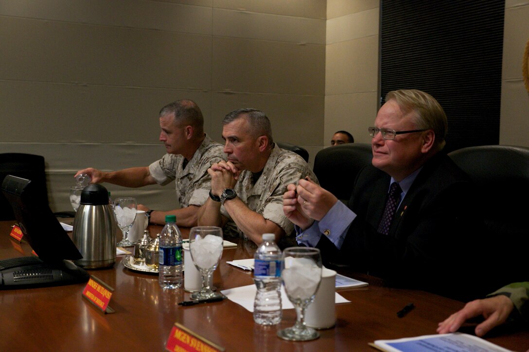 Peter Hultqvist, Sweden's Minister of Defense (right), sits in on a meeting with Lt. Gen. John E. Wissler, U.S. Marine Forces Command commanding  general, June 6, at MARFORCOM in Norfolk, Virginia. (Official U.S. Marine Corps Photo by Cpl. Calvin Shamoon/ Released)