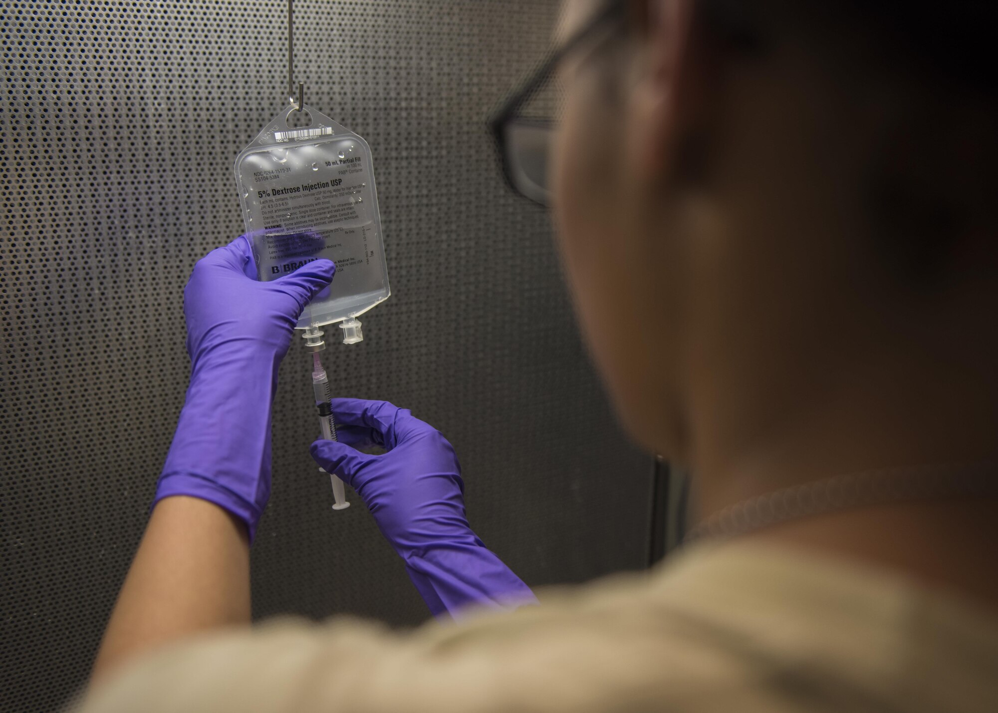 Senior Airman Latoya Kirven, 455th Expeditionary Medical Group pharmacy technician, makes an intravenous(IV) medication for patients at Craig Joint Theater Hospital, Bagram Airfield, Afghanistan, June 06, 2016. Airmen of the 455th EMDG pharmacy have made 621 IVs, filled 1,487 prescriptions, and compounded 9,119 doses for patients within the past month. (U.S. Air Force photo by Senior Airman Justyn M. Freeman)