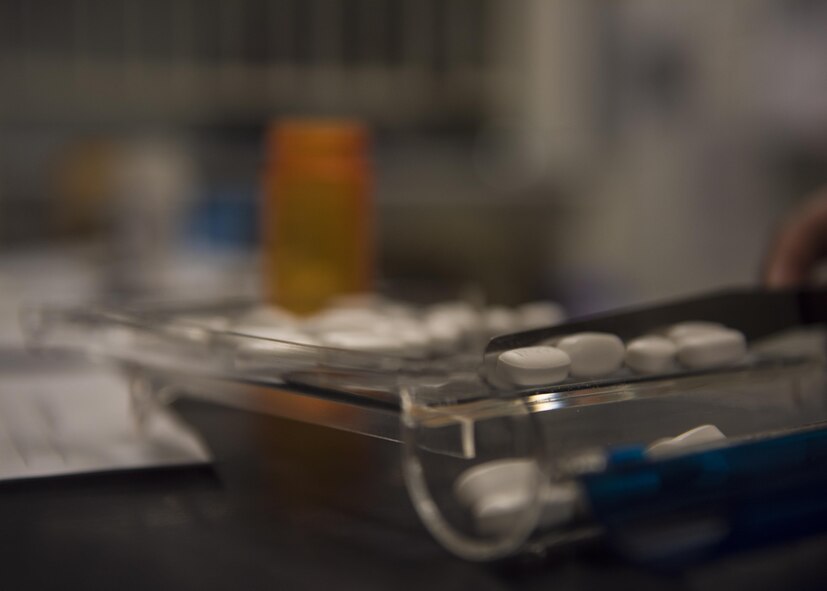 Senior Airman Latoya Kirven, 455th Expeditionary Medical Group pharmacy technician, counts pills to fill a prescription at Craig Joint-Theater Hospital, Bagram Airfield, Afghanistan, June 06, 2016. Kirven helps supply the hospital with medication and fills close to 1500 on a monthly basis. (U.S. Air Force photo by Senior Airman Justyn M. Freeman)