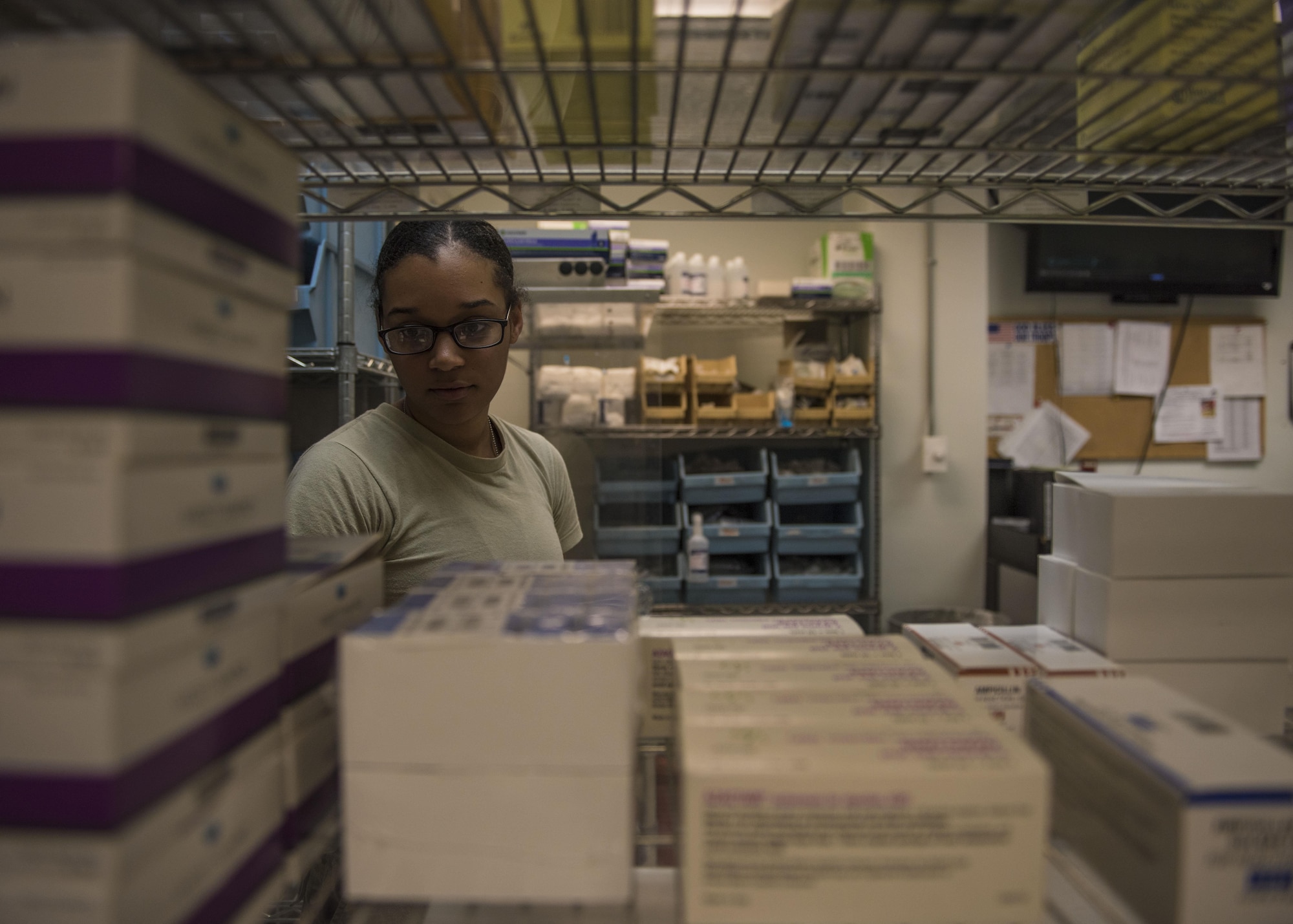 Senior Airman Latoya Kirven, 455th Expeditionary Medical Group pharmacy technician, checks expiration dates on supplies at the Craig Joint-Theater Hospital, Bagram Airfield, Afghanistan, June 06, 2016. The pharmacy checks expiration dates to keep stock up to date as well as making sure the medication is usable. (U.S. Air Force photo by Senior Airman Justyn M. Freeman)