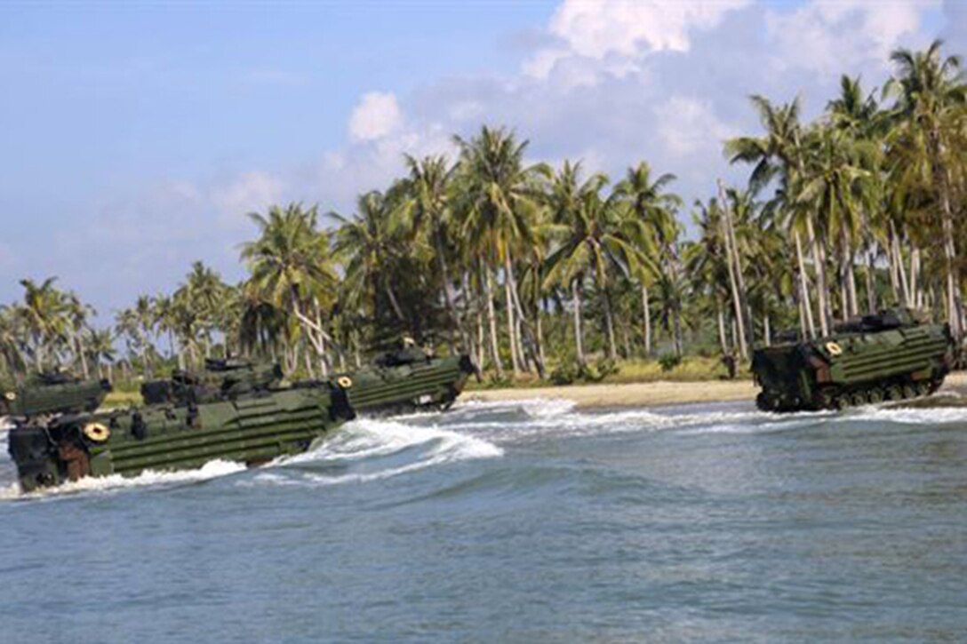 Marines assigned to Echo Company, Battalion Landing Team, 2nd Battalion, 2nd Marine Regiment conduct an amphibious transition from ship to shore at Tanduo Beach, Malaysia, May 30, 2016. U.S. Marine photo by By Lance Cpl. Carl King Jr.