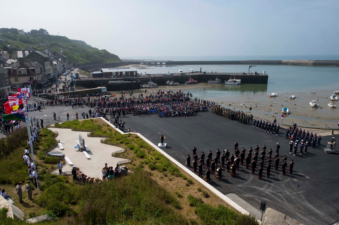 Government officials and service members attend the 47th Royal Marine Commando Monument Ceremony commemorating D-Day in Port En Bessin, France, June 6, 2016. Navy photo by Petty Officer 1st Class Sean Spratt