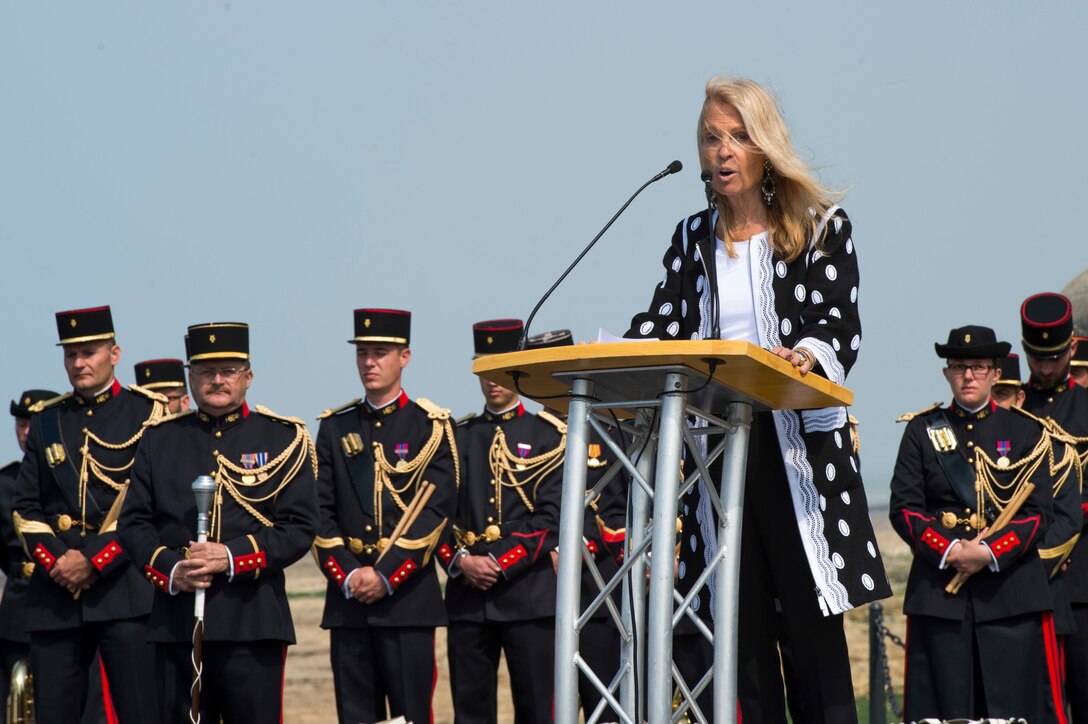 Jane Hartley, U.S. ambassador to France and Monaco, speaks during the 47th Royal Marine Commando Monument Ceremony honoring the sacrifices of World War II veterans in Port En Bessin, France, June 6, 2016. More than 380 service members from Europe and D-Day historical units participated in 72nd anniversary events. Navy photo by Petty Officer 1st Class Sean Spratt