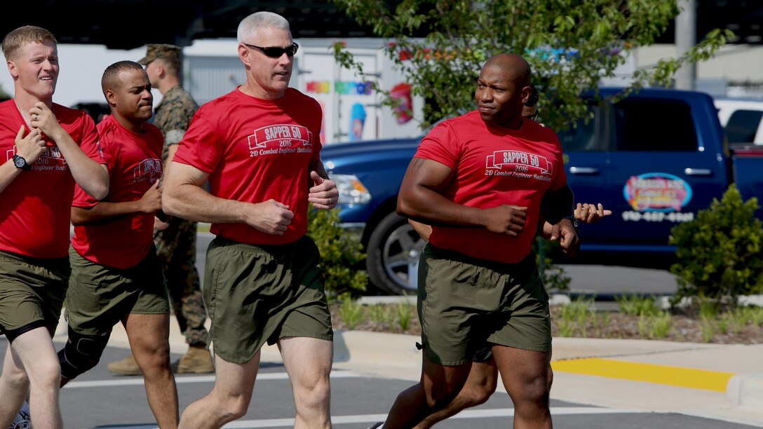 Maj. Gen. Brian Beadreault, 2nd Marine Division Commanding General, runs alongside Gunnery Sgt. Justin Hickman, a combat engineer with 2nd Combat Engineer Battalion, during the “Sapper 50” memorial at Marine Corps Base Camp Lejeune, North Carolina, June 4, 2016. The run was to honor the 29 fallen 2nd CEB Marines who gave their lives during Operations Enduring Freedom and Iraqi Freedom.  The Marines ran as a large group to demonstrate their mission to always remain faithful toward the members of the battalion.