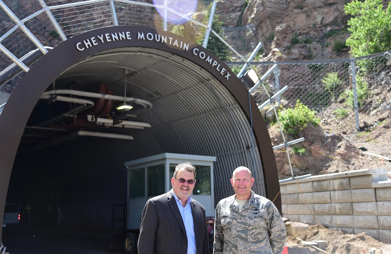 CHEYENNE MOUNTAIN AIR FORCE STATION, Colo. – Tony Scott, Federal Chief Information Officer of the United States, and Col. Gary Cornn, 721st Mission Support Group commander, pause outside the north portal to the Cheyenne Mountain Complex.  Scott received a personal tour of “America’s Fortress” as part of the yearlong celebration of the mountains 50th year.  (U.S. Air Force photo by Staff Sgt. Amber Grimm) 