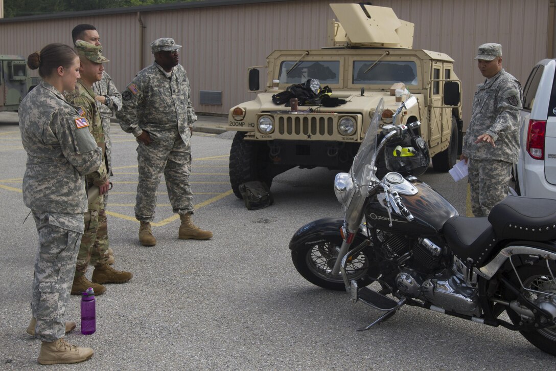 Sgt. Mesa Niravanh (right), a U.S. Army Reserve Soldier assigned to the 200th Military Police Command, conducts a motorcyle safety class as part of the unit's annual safety stand-down training June 4 at Fort Meade, Md. (U.S. Army photo by Sgt. Erick Yates) 