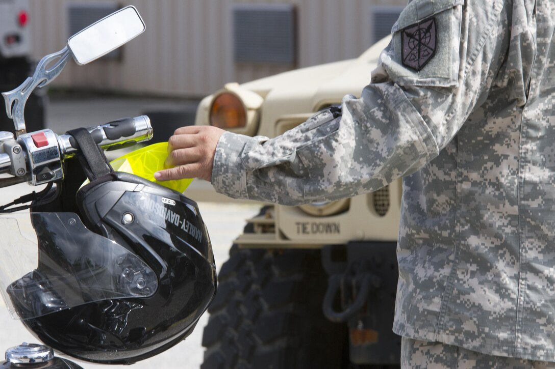 A U.S. Army Reserve Soldier from the 200th Military Police Command, provides instructions on the proper gear to wear during a motorcycle safety class as part of the unit's safety stand-down training June 4 at tat Fort Meade, Md. (U.S. Army photo by Sgt. Ida Irby) 